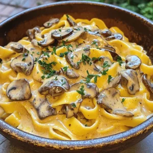 For a tasty vegan mushroom stroganoff, you need fresh, vegan-friendly ingredients. Here is what you will need: - 12 oz wide egg-free pasta (like fettuccine or tagliatelle) - 2 tablespoons olive oil - 1 medium onion, diced - 3 cloves garlic, minced - 16 oz mixed mushrooms, sliced (cremini, shiitake, and button) - 1 teaspoon dried thyme - 1 teaspoon smoked paprika - Salt and pepper to taste - 2 tablespoons soy sauce or tamari - 1 cup vegetable broth - 1 cup coconut milk (or unsweetened almond milk) - 2 tablespoons nutritional yeast (optional) - Fresh parsley, chopped for garnish These ingredients come together to create a rich and creamy dish that is purely plant-based. Some ingredients in this recipe add unique flavors. Coconut milk gives a creamy texture and rich taste. It is a great substitute for dairy. You can also use unsweetened almond milk if you prefer. Nutritional yeast is another special ingredient. It adds a cheesy flavor to the dish. You can leave it out if you want a simpler taste. Mushrooms are the star here. Using a mix of mushrooms gives depth to the flavor. Cremini mushrooms are earthy, while shiitake adds a slight smokiness. Button mushrooms are mild and blend well. Choosing the right mix enhances the dish’s overall taste. For the full recipe, check the [Full Recipe]. To start, you need to boil the pasta. Fill a large pot with water and add a pinch of salt. Bring the water to a rolling boil. Then, add 12 oz of wide egg-free pasta. Cook it according to the package instructions until it is al dente. This usually takes about 8 to 10 minutes. Stir the pasta occasionally to keep it from sticking. Once done, drain the pasta in a colander. Be sure to reserve about ½ cup of the pasta water. This water can help thicken your sauce later. Next, it’s time to sauté the aromatics. In a large skillet, heat 2 tablespoons of olive oil over medium heat. Add 1 medium diced onion and a pinch of salt. Cook the onion until it turns translucent, which should take about 4 to 5 minutes. Then, stir in 3 minced garlic cloves and cook for 30 seconds. This step is key for building flavor. Now add 16 oz of mixed mushrooms, sliced. Increase the heat to medium-high and sauté for about 6 to 8 minutes. You want the mushrooms to turn golden brown and release their juices. This enhances the dish's taste. Now, let’s create that creamy sauce. Stir in 1 teaspoon of dried thyme, 1 teaspoon of smoked paprika, and 2 tablespoons of soy sauce. Season with salt and pepper to taste. Next, pour in 1 cup of vegetable broth and bring the mixture to a simmer. Let it cook for about 5 minutes to reduce slightly. After this, lower the heat and add 1 cup of coconut milk. If you want a cheesy flavor, also add 2 tablespoons of nutritional yeast. Stir everything until well combined and heated through. If the sauce seems too thick, add a bit of that reserved pasta water until you reach your desired consistency. With these steps, your Vegan Mushroom Stroganoff will be rich and creamy, bursting with flavor. Don't forget to check the seasoning as you go! To adjust the thickness of your sauce, add a little pasta water. This helps make it creamy. If it's too thick, mix in more water until it feels just right. For creaminess, use coconut milk or almond milk. These options add richness without dairy. Seasoning balance is key. Taste as you cook. Add salt slowly, and use fresh herbs for flavor. Smoked paprika and thyme bring warmth. Nutritional yeast can add a cheesy taste. It’s optional but highly recommended. You can cook your pasta and sauce together. Start boiling the pasta while you sauté the onions. This saves time. When the pasta is almost done, add it to the sauce. Cook it all together for a few minutes to blend flavors. Multi-tasking is your friend in the kitchen. While the pasta cooks, chop the onions and garlic. This keeps everything moving smoothly. Keeping an eye on both pots helps the meal come together faster. For herbs, fresh parsley is great. It adds a pop of color and taste. You can also try chives or dill for a twist. Consider adding some crushed red pepper for a kick. For a beautiful presentation, serve the stroganoff in a large bowl. Drizzle olive oil on top for shine. You can pair this dish with a simple side salad. It makes the meal feel complete and fresh. {{image_2}} You can easily make this dish gluten-free. Just swap the pasta for gluten-free options, like rice noodles or chickpea pasta. These choices taste great and keep the same creamy texture. Adding extra vegetables boosts nutrition and flavor. Try spinach, bell peppers, or zucchini in your stroganoff. Sauté them with the onions and garlic for a tasty mix. To change the flavor profile, use different spices or herbs. For a more earthy taste, add rosemary or sage. If you want a bit of heat, sprinkle in some red pepper flakes. If you aren't strictly vegan, top your stroganoff with cooked lentils, chickpeas, or even some grilled chicken. These additions give you extra protein and make the dish heartier. On a budget? Use frozen mushrooms or canned coconut milk. These options are cost-effective and still delicious. For a lower-calorie version, try using less coconut milk and more vegetable broth. You can also add more veggies to fill you up while keeping calories down. If you need more protein, mix in some tofu or tempeh. These ingredients are great plant-based options and will keep you satisfied. Check out the Full Recipe for more ideas and tips on how to make this dish your own! To keep your Vegan Mushroom Stroganoff fresh, store leftovers in an airtight container. Let the dish cool to room temperature before sealing. Place the container in the fridge. This way, it stays good for about 3 to 5 days. For best results, use glass or BPA-free plastic containers. These materials help keep flavors intact. For reheating, the microwave is quick, but the stovetop is best. On the stove, add a splash of water or vegetable broth to keep the dish moist. Cook on low heat, stirring often. This helps the sauce stay creamy and prevents burning. If using a microwave, cover the dish with a microwave-safe lid to trap steam. You can freeze Vegan Mushroom Stroganoff, but some textures may change. To freeze, let it cool completely. Then, place it in a freezer-safe container or bag. Be sure to remove excess air. This dish can be frozen for up to 3 months. To thaw, move it to the fridge overnight. Reheat gently on the stove or in the microwave, adding a bit of liquid to restore creaminess. To make this dish gluten-free, swap the pasta for gluten-free options. Look for pasta made from brown rice or chickpeas. These options cook well and taste great. For the soy sauce, use tamari, which is gluten-free. Most other ingredients in this recipe are naturally gluten-free, so you’re in good shape! Yes, you can make this dish without nuts. Instead of coconut milk, try unsweetened almond milk or oat milk. Both add creaminess without nut flavors. You can skip nutritional yeast if you prefer. Instead, add a pinch of garlic powder or onion powder for depth. Vegan Mushroom Stroganoff lasts about 3-5 days in the fridge. Store it in an airtight container to keep it fresh. When you reheat, add a splash of vegetable broth or water to keep it creamy. For vegan stroganoff, use wide egg-free pasta like fettuccine or tagliatelle. These shapes hold the sauce well. You can also choose gluten-free pasta for a different texture. Other options include whole wheat pasta or even spiralized veggies for a fun twist! Yes, you can prepare Vegan Mushroom Stroganoff ahead of time. Cook the pasta and sauce separately. Store them in the fridge, and combine them when ready to serve. This helps keep the pasta from getting mushy. Reheat gently on the stove with a bit of broth or water. Serve this dish with a fresh side salad or steamed veggies for balance. Crusty bread makes a great addition too! If you want something hearty, try roasted potatoes or quinoa. These sides make your meal complete and satisfying. For the full recipe, check out the details above! This guide covers vegan mushroom stroganoff, from ingredients to storage tips. You learned about vegan-friendly items, unique flavors, and how to make a creamy sauce. I shared cooking techniques, garnishing ideas, and ways to customize your dish. With these insights, you can make delicious meals for any occasion. Remember, cooking is fun and gives you room to be creative. Enjoy exploring and making this dish your own!