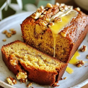 To make classic banana bread, you need: - 3 ripe bananas, mashed - 1/3 cup melted coconut oil - 1/2 cup brown sugar - 1 large egg, beaten - 1 teaspoon vanilla extract - 1 teaspoon baking soda - Pinch of salt - 1 1/2 cups all-purpose flour - 1/2 cup chopped walnuts or pecans - 1/4 teaspoon cinnamon (optional) You can enhance your banana bread with: - Chocolate chips for sweetness - Dried fruit like raisins or cranberries - Coconut flakes for a tropical twist - Nutmeg for a warm spice flavor Running low on an ingredient? Here are some swaps: - Replace coconut oil with melted butter. - Use granulated sugar instead of brown sugar. - Swap all-purpose flour for whole wheat flour for a healthier option. - For a vegan version, use flaxseed meal mixed with water instead of the egg. These tips will help you customize your banana bread to fit your taste! For the full recipe, check the main section. Gather all your ingredients first. You want to have everything ready. For this recipe, you will need: - 3 ripe bananas, mashed - 1/3 cup melted coconut oil - 1/2 cup brown sugar - 1 large egg, beaten - 1 teaspoon vanilla extract - 1 teaspoon baking soda - Pinch of salt - 1 1/2 cups all-purpose flour - 1/2 cup chopped walnuts or pecans - 1/4 teaspoon cinnamon (optional) Make sure your bananas are very ripe. The more brown spots, the better. They will add sweetness and flavor to your bread. Start by preheating your oven to 350°F (175°C). Grease a 9x5 inch loaf pan or line it with parchment paper. In a large bowl, mix the mashed bananas with the melted coconut oil. Stir until they combine well. Next, add the brown sugar and mix again. Then, pour in the beaten egg and vanilla extract. Mix until everything blends. Now, add the baking soda and salt. Stir well. If you like, sprinkle in the cinnamon for extra flavor. Gradually add the flour. Stir gently until just mixed. It’s okay to have some lumps; don’t overmix. Finally, fold in the chopped walnuts or pecans. Pour the batter into the prepared loaf pan. Smooth the top with a spatula. Bake in your preheated oven for 50-60 minutes. Check for doneness by inserting a toothpick in the center. If it comes out clean, your bread is ready. After baking, let the banana bread cool in the pan for about 10 minutes. Then, transfer it to a wire rack to cool completely. Slice the banana bread and serve it warm. You can add a pat of butter for extra flavor. To make it even better, toast the slices for a crunchy treat. For a beautiful presentation, sprinkle some chopped nuts on top. For the full recipe, visit the link provided. When making banana bread, it’s easy to make a few errors. Here are some common mistakes: - Using unripe bananas: Always use ripe bananas. They should be brown and soft. - Overmixing the batter: Mix just until combined. Lumps are okay. Overmixing makes it tough. - Incorrect oven temperature: Check your oven’s heat with a thermometer. An incorrect temp can ruin your bread. Moisture is key for great banana bread. Here are tips to keep it moist: - Use ripe bananas: They add natural sweetness and moisture. - Add coconut oil: This oil keeps the bread soft and adds flavor. - Don’t overbake: Check with a toothpick. Remove the bread when it’s just done. Baking banana bread needs the right conditions. Here’s what to consider: - Oven placement: Place your loaf pan in the center of the oven. This helps it bake evenly. - Humidity: If your kitchen is humid, you might need to adjust baking time. Keep an eye on it. - Pan type: Use a light-colored metal pan. Dark pans can cause the bottom to burn. These tips will help you bake the best banana bread. For a full recipe, check out the deliciously nutty banana bread recipe. {{image_2}} You can mix in fun ingredients to change up your banana bread. Try adding chocolate chips for a sweet twist. Dried fruit, like cranberries or raisins, adds a chewy texture. You can also fold in shredded coconut for a tropical touch. Nuts like walnuts or pecans give a nice crunch. Don't be afraid to get creative with these add-ins! Want to shake things up? You can swap out the vanilla extract for almond extract for a different flavor. Instead of brown sugar, try using maple syrup for a unique taste. If you love spices, add a dash of nutmeg along with the cinnamon. These small tweaks can make your banana bread special and unique. If you prefer smaller portions, consider making mini loaves or muffins. Use a mini loaf pan or a muffin tin to bake smaller treats. Bake mini loaves for about 30-40 minutes and muffins for 18-20 minutes. These bite-sized versions are perfect for sharing or for a quick snack. Plus, they look cute on a plate! You can find the full recipe for the classic banana bread above. To keep your banana bread fresh, wrap it tightly in plastic wrap. This helps keep moisture in. Store it at room temperature for up to three days. If you want to keep it longer, the fridge is not the best choice. It may dry out. Instead, use an airtight container or a resealable bag. Freezing is a great option if you have extra banana bread. First, let it cool completely. Then, wrap it well in plastic wrap and aluminum foil. This double layer protects it from freezer burn. You can freeze banana bread for up to three months. When ready to eat, just thaw it in the fridge overnight. To enjoy your banana bread warm, slice off a piece. Place it in the toaster for a few minutes. You can also use a microwave. Heat it for about 10-15 seconds. If you like it crispy, try reheating it in the oven at 350°F (175°C) for about 10 minutes. Enjoy it with a pat of butter or a sprinkle of nuts for extra flavor. Your bananas should be very ripe. Look for bananas with brown spots on the skin. The riper the bananas, the sweeter they taste. Overripe bananas are soft and easy to mash. This helps create a moist banana bread. If your bananas are still yellow, let them sit for a few days. They will ripen quickly. Yes, you can use whole wheat flour. It adds a nice nutty flavor. You may need to add a bit more liquid to the mix. Whole wheat flour can make your bread denser. For lighter bread, mix half all-purpose flour and half whole wheat flour. This way, you enjoy the health benefits without losing texture. If your banana bread is too dry, try a few things. First, check your baking time. Baking it for too long can dry it out. Next, add extra mashed banana next time. This will boost moisture. If it's already baked, serve slices with butter or cream cheese. You can also reheat slices in the microwave for a few seconds to soften them. For the next batch, follow the Full Recipe closely for best results. You now have all the tools to make great banana bread. We covered essential ingredients, tasty add-ins, and smart tips to avoid mistakes. I shared easy steps for perfect mixing and baking too. Remember to check your bananas for ripeness and use proper storage methods. With these insights, you can make banana bread that everyone loves. Enjoy experimenting with flavors and variations! Happy baking!