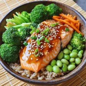 To make the teriyaki salmon bowls, you will need: - 2 salmon fillets - 1/4 cup soy sauce - 2 tablespoons honey - 1 tablespoon rice vinegar - 1 teaspoon sesame oil - 1/2 tablespoon grated ginger - 1 garlic clove, minced - 2 cups cooked brown rice - 1 cup broccoli florets - 1 carrot, julienned - 1/2 cup edamame (shelled) - 1 tablespoon sesame seeds - Green onions, thinly sliced for garnish If you lack some ingredients, here are some great swaps: - Salmon fillets: Use trout or chicken. - Soy sauce: Coconut aminos or tamari work well. - Honey: Maple syrup can be a sweet choice. - Rice vinegar: Apple cider vinegar is a good stand-in. - Sesame oil: Olive oil or canola oil can replace it. - Broccoli: You can use green beans or snap peas instead. - Edamame: Try chickpeas for a different protein. This dish is not just tasty; it's also nutritious! Here&rsquo;s a quick look: - Calories per serving: About 500 - Protein: 35g - Carbohydrates: 60g - Fat: 15g - Fiber: 8g These numbers can vary based on your ingredient choices. For a balanced meal, the mix of protein, healthy fats, and fiber is great! Feel free to check the Full Recipe for more details on how to make these bowls. First, gather all your ingredients. You need: - 2 salmon fillets - 1/4 cup soy sauce - 2 tablespoons honey - 1 tablespoon rice vinegar - 1 teaspoon sesame oil - 1/2 tablespoon grated ginger - 1 garlic clove, minced - 2 cups cooked brown rice - 1 cup broccoli florets - 1 carrot, julienned - 1/2 cup shelled edamame - 1 tablespoon sesame seeds - Green onions, thinly sliced Next, make the teriyaki sauce. In a small bowl, whisk together the soy sauce, honey, rice vinegar, sesame oil, grated ginger, and minced garlic. This sauce adds rich flavor to the dish. Now, marinate the salmon. Place the fillets in a shallow dish and pour half of the teriyaki sauce over them. Let them sit for at least 15 minutes. This step helps the fish soak up the flavors. While the salmon marinates, cook the vegetables. Steam the broccoli and carrots until they are just tender, about 5-7 minutes. You can use a steaming basket or microwave. Set them aside after cooking. Next, heat a skillet over medium-high heat. Once it&rsquo;s hot, add the marinated salmon. Discard any leftover marinade. Cook the salmon for about 4-5 minutes on each side. It is done when it flakes easily with a fork. Now, it&rsquo;s time to assemble your bowls. Start with a base of brown rice in each bowl. Arrange the steamed broccoli, carrots, and edamame on top. Place the cooked salmon fillets next. Drizzle the remaining teriyaki sauce over the bowls. Finally, sprinkle sesame seeds and garnish with sliced green onions. For a beautiful touch, consider using a bamboo mat for serving. For the complete recipe, check out the Full Recipe. Enjoy your vibrant and tasty teriyaki salmon bowls! To make great teriyaki sauce, use fresh ingredients. Combine soy sauce, honey, rice vinegar, sesame oil, grated ginger, and minced garlic. Whisk them together well. Adjust the sweetness by adding more honey if you like it sweeter. For a thicker sauce, simmer it on low heat until it thickens. This makes it stick to your salmon and veggies. Cook salmon at medium-high heat for the best texture. If you want crispy skin, start skin-side down. Cook it for about 4-5 minutes per side. The salmon is done when it flakes easily with a fork. Be careful not to overcook it, or it will dry out. Use a meat thermometer; the ideal temperature is 145&deg;F. When serving, start with a base of brown rice. Layer on the steamed broccoli, carrots, and edamame. Place the salmon on top for a nice look. Drizzle extra teriyaki sauce over the whole bowl. Finish with sesame seeds and sliced green onions. This adds flavor and a pop of color. For a fun twist, serve with chopsticks! For the Full Recipe, check the previous section. {{image_2}} If you want a meat-free meal, try tofu! Use firm tofu for the best texture. Press it to remove extra water, then cube it. Marinate the tofu in the same teriyaki sauce. Cook it until golden brown in a pan. You can also use tempeh or seitan for extra flavor and protein. Salmon is great, but many other proteins work well too. Chicken thighs or breasts are tasty and easy to cook. Just cut them into bite-sized pieces and marinate like the salmon. Shrimp is another quick option. Cook it for about 2-3 minutes per side until pink. For a unique twist, try beef or pork. Just slice thinly and marinate for a bold flavor. You can boost the taste in many ways. Add crushed red pepper for heat. A sprinkle of lime juice adds brightness. Experiment with fresh herbs like cilantro or basil for a fresh touch. For a richer taste, mix in some peanut butter or hoisin sauce into the teriyaki. These tweaks can make your dish more exciting and fun! If you want to follow a complete guide, check out the Full Recipe for more ideas. You can keep leftover teriyaki salmon bowls in an airtight container. Make sure to cool them first. Place them in the fridge for up to three days. Keep the salmon, rice, and veggies together for best flavor. To reheat, use the microwave for quick warmth. Place the bowl in a microwave-safe dish and cover it. Heat for one to two minutes. Stir halfway to ensure even warming. You can also use a skillet on low heat. This method helps keep the salmon moist. If you want to freeze them, separate the salmon from the rice and veggies. Place each in freezer bags or containers. You can freeze the salmon for up to three months. The rice and veggies can freeze for about one month. When ready to eat, thaw in the fridge overnight before reheating. Enjoy your meal without waste! Yes, you can use frozen salmon. Just thaw it first. Place it in the fridge overnight. If you need it fast, you can run it under cold water for about 30 minutes. This will help keep the texture nice and flaky after cooking. If you want a change, try quinoa or cauliflower rice. Quinoa adds a nutty taste and is full of protein. Cauliflower rice is low in carbs and very light. You can also use white rice if that&rsquo;s what you have on hand. To make the dish gluten-free, use tamari instead of soy sauce. Tamari is a gluten-free soy sauce that gives you the same rich flavor. Check your other ingredients too, like rice vinegar, to ensure they are gluten-free. You can find the Full Recipe for Teriyaki Salmon Bowls in the article above. It has all the steps and tips for making this tasty dish. A fresh salad pairs well with Teriyaki Salmon Bowls. You can make a simple cucumber salad with rice vinegar and sesame oil. It adds a nice crunch and balances the meal. Steamed or grilled vegetables also work great! This blog post covered the key ingredients for teriyaki salmon, including substitutes and nutrition facts. I shared step-by-step cooking instructions, tips for perfect sauce and salmon, and suggested variations for all diets. I also provided storage tips and answered common questions. Now, you have the tools to make an amazing teriyaki salmon dish. Enjoy experimenting with flavors and techniques. Your kitchen is ready for great meals!