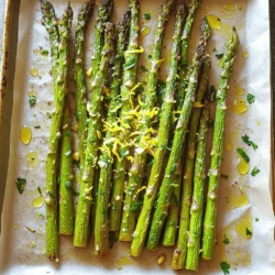 To make Lemon Garlic Roasted Asparagus, you need a few key items. Here’s the list: - 1 lb (450g) fresh asparagus, trimmed - 3 tablespoons olive oil - 3 cloves garlic, minced - Juice and zest of 1 lemon - ½ teaspoon salt - ¼ teaspoon black pepper - ¼ teaspoon red pepper flakes (optional for heat) - 2 tablespoons grated Parmesan cheese (optional for flavor) - Fresh parsley, chopped (for garnish) These ingredients come together to create a bright, zesty side dish. The fresh asparagus shines with the lemon and garlic flavors. Want to take it up a notch? You can add a few optional ingredients. Here are some ideas: - Crushed nuts for crunch - A drizzle of balsamic glaze for sweetness - Fresh herbs like thyme or rosemary for earthiness These additions can make your dish even more exciting. Try mixing and matching to find your favorite flavor combo. Choosing the right asparagus is key to this dish. Look for asparagus that is bright green and firm. Here are some tips: - Check the tips; they should be closed and compact. - Avoid any that look wilted or slimy. - The stalks should be smooth and straight, not bendy. Fresh asparagus makes a big difference in taste. When you find the best, you’ll enjoy a delicious side with every bite. If you want the full recipe, check out the details above! First, you need to wash the asparagus. Hold the stalks and rinse them under cold water. Then, trim off the tough ends. This part can be hard and woody. You want to cut about one to two inches from the bottom. After that, you can dry the asparagus with a clean towel. This step helps the oil stick better. Next, grab a large bowl. Add three tablespoons of olive oil to it. Then, mince three cloves of garlic and toss them in. Now, take one lemon. Squeeze its juice and add that to the bowl. Don’t forget to add the lemon zest for extra flavor. Finally, sprinkle in half a teaspoon of salt and a quarter teaspoon of black pepper. If you like heat, add some red pepper flakes too. Mix everything well with a whisk or fork. Now it’s time to roast! Preheat your oven to 425°F (220°C). Line a baking sheet with parchment paper. This makes cleanup easy. Add the trimmed asparagus into the bowl with the lemon garlic mix. Toss them until they are fully coated. Spread the asparagus on the baking sheet in a single layer. Roast them for 12 to 15 minutes. Flip them halfway through to cook evenly. If you want, sprinkle some grated Parmesan cheese on top in the last two minutes. This adds great flavor. When they are done, take them out and garnish with fresh parsley. You can find the full recipe for this dish to enjoy with your family! To get crispy asparagus, start with fresh spears. Trim the tough ends before cooking. Use enough olive oil to coat each piece. This helps them crisp up in the oven. Spread the asparagus in a single layer on the baking sheet. Avoid crowding; it steams instead of roasts. Flip them halfway through cooking. This ensures even browning on all sides. You can change up the flavors to keep things exciting. Want a smoky taste? Add some smoked paprika to the mix. For a kick, try adding more red pepper flakes. If you love cheese, experiment with different types. Feta or goat cheese can bring a new twist. You can also mix in other herbs like thyme or rosemary. Each brings a fresh taste to your dish. Lemon garlic roasted asparagus makes a great side dish. It pairs well with grilled chicken or fish. You can also serve it with pasta for a hearty meal. For a light lunch, add it to a salad. Top with some nuts or seeds for crunch. You can even serve it as an appetizer. Just place it on a platter with a dip or sauce. This dish is versatile and adds color to any table. For the full recipe, check out the detailed instructions. {{image_2}} You can make Lemon Garlic Roasted Asparagus vegan with just a few changes. Omit the Parmesan cheese, and your dish remains tasty. Instead, you can add nutritional yeast for a cheesy flavor. It adds a nice twist while keeping everything plant-based. Remember, the lemon and garlic still shine through! Why not mix in some other veggies? Broccoli, bell peppers, or cherry tomatoes work well here. Just chop them to similar sizes as the asparagus. Toss them in the same lemon garlic mixture and roast together. This adds color and flavor. Plus, it makes your meal more vibrant and fun! Feel free to play with seasonings based on your taste. Add herbs like thyme or rosemary for a fresh twist. You can also try some spice blends like Cajun or Italian. If you want more heat, increase the red pepper flakes. Each change brings new life to your dish. Explore these options to keep it exciting! For the complete experience, check out the Full Recipe. After you enjoy your Lemon Garlic Roasted Asparagus, store any leftovers in an airtight container. Place the container in your fridge. The asparagus will stay fresh for about 3 to 5 days. If you want to keep the flavor strong, avoid stacking them. This keeps them from getting soggy. When you’re ready to eat your leftovers, reheating is key. Preheat your oven to 350°F (175°C). Place the asparagus on a baking sheet. Heat them for about 10 minutes. This helps them stay crispy. You can also microwave them for 30 seconds to 1 minute. But be careful not to overcook, or they may lose their crunch. If you want to save your Lemon Garlic Roasted Asparagus for later, freezing is an option. First, blanch the asparagus in boiling water for 2 minutes. Then, cool them in ice water. Drain and dry them well. Place them in freezer bags and remove the air. They can last about 3 months in the freezer. When ready to use, bake them straight from frozen for a quick side dish. For the full recipe, check the recipe card above. Yes, you can use frozen asparagus. However, fresh asparagus tastes best. Frozen spears may lose some crunch. If using frozen, do not thaw before cooking. Roast them straight from the freezer. Adjust the roasting time if needed, as frozen may take longer to cook. Asparagus is done when it is bright green and tender. You should see slight browning on the tips. A fork should easily pierce the spears. I recommend flipping the asparagus halfway through cooking. This ensures even roasting. If you want extra crispness, roast a bit longer. Lemon garlic roasted asparagus pairs well with many dishes. Try it with grilled chicken or fish for a light meal. It also complements pasta dishes nicely. For a hearty option, serve it alongside steak or pork. You can even mix it into grain bowls for extra flavor. For a full recipe, check out the detailed instructions above. In this post, we covered how to make delicious lemon garlic roasted asparagus. I shared key ingredients, including optional additions for extra flavor. You learned simple steps for prep and roasting. We also explored tips for achieving crispy asparagus and serving ideas. In the end, this recipe is flexible and fun. Experiment with flavors and enjoy your meal! Eating fresh veggies never tasted so good.