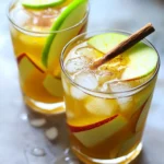 To make a delicious apple cider mocktail, you need a few key ingredients. Here’s what you will need: - 2 cups apple cider - 1 cup sparkling water - 1 tablespoon fresh lemon juice - 1 teaspoon ground cinnamon - 1 teaspoon ginger syrup (or to taste) - Ice cubes These main ingredients create a fresh and fruity drink. The apple cider offers a sweet base. The sparkling water adds fizz. Fresh lemon juice gives a zesty kick. Cinnamon brings warmth, while ginger syrup adds a hint of spice. You can make your mocktail even better with some fun garnishes. Here are a few ideas: - Slices of fresh apple for garnish - Cinnamon sticks for garnish Adding apple slices makes the drink look pretty. Cinnamon sticks not only look great but also add more flavor. You can also try other fruits, like oranges or pears, for a twist. Apple cider isn’t just tasty; it also has some health perks. Here are a few benefits of adding apple cider to your drink: - Rich in antioxidants, which help your body fight free radicals. - May support heart health by lowering cholesterol levels. - Contains vitamins like vitamin C, which boosts your immune system. Using apple cider in your mocktail makes it a fun and healthy choice for any occasion. Enjoy the flavors while also getting a health boost! 1. Start by getting a large pitcher. Add 2 cups of apple cider. 2. Next, squeeze in 1 tablespoon of fresh lemon juice. 3. Sprinkle in 1 teaspoon of ground cinnamon. Stir well until the cinnamon mixes in. 4. Now, pour in 1 teaspoon of ginger syrup. This adds a nice kick. 5. Taste the mixture. If you want more sweetness, add more ginger syrup. 6. Take some glasses and fill them with ice cubes. 7. Pour the apple cider mixture over the ice until each glass is about two-thirds full. 8. Top off each drink with 1 cup of sparkling water. Stir gently to keep the fizz. 9. Finally, garnish with fresh apple slices and a cinnamon stick. - Use fresh apple cider for the best taste. - Chill your glasses in the fridge for a refreshing touch. - Serve the mocktail right away to enjoy the fizz. - For a fun twist, try adding a splash of cranberry juice. - If you like it sweeter, add more ginger syrup. - You can also try using honey or agave syrup for sweetness. - To change the flavor, add more lemon juice for a tangy taste. - Experiment with spices like nutmeg or allspice for a unique twist. Hosting with mocktails is fun and easy. Always have the ingredients ready. Make a big batch in a pitcher, so guests can serve themselves. This keeps the party flowing. Offer a few different mocktail options. Variety makes it more exciting for everyone. Don’t forget to have ice ready for guests. It keeps drinks cold and refreshing. Apple cider mocktails fit every season. In fall, use warm spices like nutmeg and cloves. Add a splash of cranberry juice for a holiday twist. In spring, mix fresh mint leaves for a bright taste. You can even add some berries for color. Summer calls for lemon or lime to brighten the flavors. Each season brings a new chance to enjoy this drink! Presentation makes any drink special. Use clear glasses to show off the beautiful layers. Add a slice of fresh apple on the rim for color. A cinnamon stick adds a rustic touch. For a festive look, try using fun straws. You can even rim the glasses with sugar or cinnamon. Little details make your mocktails stand out! {{image_2}} You can make your Apple Cider Mocktail more fun by adding fruits. Try adding slices of pear for a soft and sweet taste. Pomegranate seeds add a burst of color and tang. Cranberries bring a tart flavor that mixes well with apple. You can also use orange slices for a zesty kick. Each fruit adds its unique twist, turning your drink into a fresh creation. If you want to skip ginger syrup, use honey or maple syrup. Both sweeteners add flavor without losing the mocktail’s charm. For a spicier touch, try cinnamon syrup. It pairs well with apple cider, making your drink taste warm and cozy. Adjust the amount based on your taste to create the perfect balance. For a fizzy twist, you can swap sparkling water for ginger ale or club soda. Ginger ale adds a sweet and spicy flavor, while club soda keeps it light and crisp. You can also use sparkling apple juice for extra apple flavor. These options keep your drink lively and fun, perfect for any gathering. To store leftover ingredients, keep them in airtight containers. This helps keep the flavors fresh. You can store apple cider in the fridge for about a week. If you have extra ginger syrup, store it in a cool, dark place. For lemon juice, use a small jar and seal it well. You can make this mocktail ahead. Mix the apple cider, lemon juice, and cinnamon in advance. Store it in the fridge for up to three days. Just add sparkling water right before serving. This keeps the fizz lively. For the best taste, wait to add garnishes until serving time. Apple cider usually lasts about a week in the fridge. If it smells off or changes color, toss it. Ginger syrup can last about a month if stored well. Fresh lemon juice stays fresh for up to a week too. Always check for freshness before using any ingredients. To make the mocktail less sweet, you can adjust the amount of ginger syrup. Start with less syrup, then taste the mix. If it needs more zing, add a little more, but keep it light. You can also add more lemon juice. The tartness from the lemon helps balance the drink. Another great tip is to use less apple cider and add more sparkling water. This trick keeps the flavor while reducing sweetness. Yes, you can use store-bought apple cider. It saves time and still tastes good. Look for a brand with no added sugar for the best flavor. Fresh apple cider can have a richer taste, but store-bought works well. Just check the label to ensure it’s pure. If it has extra flavors, it might change your mocktail a bit. Apple cider mocktails are perfect for many occasions. They shine at fall gatherings like Halloween or Thanksgiving. The warm spices match the season. You can serve them at holiday parties, too. Guests love the festive look and taste. They also work well for family dinners or brunches. Kids and adults both enjoy this drink. It’s a fun way to celebrate any special day! This blog post covered how to make a delicious Apple Cider Mocktail. We explored main ingredients, optional garnishes, and health benefits. You now have step-by-step instructions to create the perfect drink. Plus, I shared valuable tips for hosting with mocktails and ideas for variations. Remember to store leftovers properly to enjoy later. Overall, apple cider mocktails are a fun and fruity choice. I hope you feel inspired to mix up your own refreshing drinks!