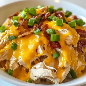 To make the best Crockpot Crack Chicken, you need a few simple items. Each ingredient plays a key role in building flavor and texture. Here’s what you will need: - 2 lbs boneless, skinless chicken breasts - 1 packet ranch seasoning mix - 1 (8 oz) package cream cheese - 1 cup cheddar cheese, shredded - 1/2 cup cooked bacon, chopped - 1/4 cup green onions, chopped - 1 cup chicken broth - Salt and pepper to taste - Optional: Sliced jalapeños for heat Each of these ingredients adds something special. The chicken gives a hearty base, while the ranch mix brings a tangy kick. Cream cheese adds creaminess, and cheddar offers a rich flavor. The bacon provides crunch, and green onions add a fresh note. Chicken broth keeps everything moist and tasty. If you like heat, jalapeños are a great choice! Make sure to gather these items before starting. This will help you stay organized and make cooking easier. Enjoy the process of creating this delicious meal! {{ingredient_image_1}} Start by placing the chicken breasts in the bottom of your crockpot. This is the base of your dish. Next, season the chicken with salt and pepper. Sprinkle the ranch seasoning mix evenly over the top. This mix adds great flavor. Then, pour in the chicken broth. The broth keeps the chicken moist as it cooks. Now it’s time for the cream cheese. Cut the cream cheese into small cubes. This helps it melt better in the crockpot. Place the cubes on top of the chicken and ranch mix. The cream cheese will add a rich and creamy texture to your meal. Cover the crockpot and choose your cooking time. You can cook on low for 6-8 hours or on high for 3-4 hours. Both methods will make the chicken tender. To shred the chicken, use two forks once it’s done cooking. Mix it well with the melted cream cheese and ranch seasoning. After shredding, stir in the shredded cheddar cheese and chopped bacon. Let it cook on high for another 10 minutes. This allows the cheese to melt and mix in. Before serving, top with chopped green onions and jalapeños if you like some heat. Mix them in for great flavor. Enjoy your meal! To make sure your chicken is tender, follow these steps: - Use boneless, skinless chicken breasts. They cook evenly and stay moist. - Season the chicken well with salt, pepper, and ranch mix. This adds great flavor. - Always add chicken broth. It keeps the chicken juicy and helps it cook well. - Cook on low for 6-8 hours. This longer time makes the chicken very tender. - If short on time, cook on high for 3-4 hours. It still turns out great. When using a crockpot, follow these best practices: - Don’t open the lid too often. Each time you do, heat escapes. - Layer ingredients wisely. Put chicken at the bottom, then add other items on top. - Avoid overfilling the pot. It needs space to cook evenly. - Stir the mixture gently if needed, but do this sparingly. For serving Crockpot Crack Chicken, use these ideas: - Serve it in bowls. This makes it easy for everyone to take a portion. - Top with extra green onions and jalapeños for color and taste. - Pair it with sliders for a fun meal. If you want a low-carb option, try using lettuce wraps: - Use large lettuce leaves to wrap the chicken. - This adds crunch and freshness to each bite. To boost the flavors of your Crack Chicken, consider these enhancements: - Add garlic powder or onion powder for extra depth. - Mix in some hot sauce if you like spice. - Try adding diced bell peppers for a colorful twist. - Sliced jalapeños can be added for extra heat. These small changes can make your dish even more exciting! Pro Tips Use Frozen Chicken: Using frozen chicken breasts can save you time on prep. Just add an extra hour to the cooking time, and ensure it's fully cooked through before shredding. Add More Flavor: For an extra burst of flavor, consider adding a splash of hot sauce or a tablespoon of garlic powder along with the ranch seasoning. Customize Your Cheese: Feel free to mix different types of cheese, like pepper jack for a spicy kick or mozzarella for a creamier texture. Make It a Meal: Serve the Crack Chicken over rice, pasta, or quinoa for a complete meal, or use it as a filling for tacos or burritos. {{image_2}} You can switch up the protein in this recipe. Instead of chicken, try turkey or tofu. Turkey gives a leaner option but still tastes great with ranch seasoning and cream cheese. For a vegetarian choice, tofu works well. Choose firm tofu and press it to remove extra water. Cut it into cubes and place it like the chicken. It will absorb the flavors nicely. Want to spice things up? Add some heat or extra flavor with spices. You can mix in crushed red pepper flakes for a kick. If you enjoy bold flavors, stir in some garlic powder or smoked paprika. Sliced jalapeños are great too. They add heat and a nice crunch. Experiment with your favorite spices to create a dish that suits your taste. Need to make this dish fit your diet? You can easily adapt it. For gluten-free needs, check your ranch seasoning. Many brands offer gluten-free options. If you want a dairy-free version, swap cream cheese with a dairy-free cream cheese. Use a dairy-free cheese blend for topping. These changes let you enjoy the meal without missing out on flavor. You can store leftover Crockpot Crack Chicken in the fridge. It stays good for about 3 to 4 days. Make sure to place it in an airtight container. This helps keep it fresh and tasty. Always let it cool before sealing to avoid moisture buildup. If you want to save it for later, freezing is a great option. Place the chicken in a freezer-safe container. It’s best to freeze it in single servings for easy reheating. When you’re ready to eat, just take out what you need. Let it thaw in the fridge overnight for the best results. To reheat your Crack Chicken, use the stove or microwave. If using a microwave, do it in short bursts. Stir in between to keep the heat even. On the stove, warm it in a pan over low heat. Add a splash of chicken broth if it seems dry. This helps maintain the flavor and texture. Enjoy your meal just as good as when it was fresh! Crockpot Crack Chicken is a creamy, savory dish. It features chicken, cream cheese, and ranch seasoning. This dish is popular for its rich flavor and easy preparation. Many love it for its comfort and versatility. You can serve it as a main dish or in sliders. The creamy texture makes it a hit at parties and family dinners. Yes, you can prepare Crockpot Crack Chicken in advance. You can season the chicken and add all ingredients to the crockpot. Cover and refrigerate it overnight. The next day, just cook it as directed. This will save you time and keep flavors fresh. Cooking times remain the same, either 6-8 hours on low or 3-4 hours on high. Absolutely! You can make Crockpot Crack Chicken on the stove or in the oven. For the stove, use a large pot. Add the chicken, broth, and seasonings, and simmer on low heat. Cook until the chicken is tender, about 30-40 minutes. For the oven, place everything in a baking dish. Cover tightly and bake at 375°F for about 45 minutes. To add heat to your Crockpot Crack Chicken, try adding sliced jalapeños. You can mix them in before cooking or sprinkle them on top before serving. Another option is to add hot sauce to the chicken. You can also try using spicy ranch seasoning for an extra kick. Adjust the amount based on your taste for spice. Crockpot Crack Chicken is a tasty and easy dish. You learned about its ingredients, cooking method, and serving tips. Remember to use cream cheese and cheddar for that creamy texture. Try different proteins or spices to make it your own. Store leftovers well to enjoy later. This dish fits everyone, with options for low-carb diets. With simple steps, you can impress your family. Now it’s your turn to enjoy a delicious meal!
